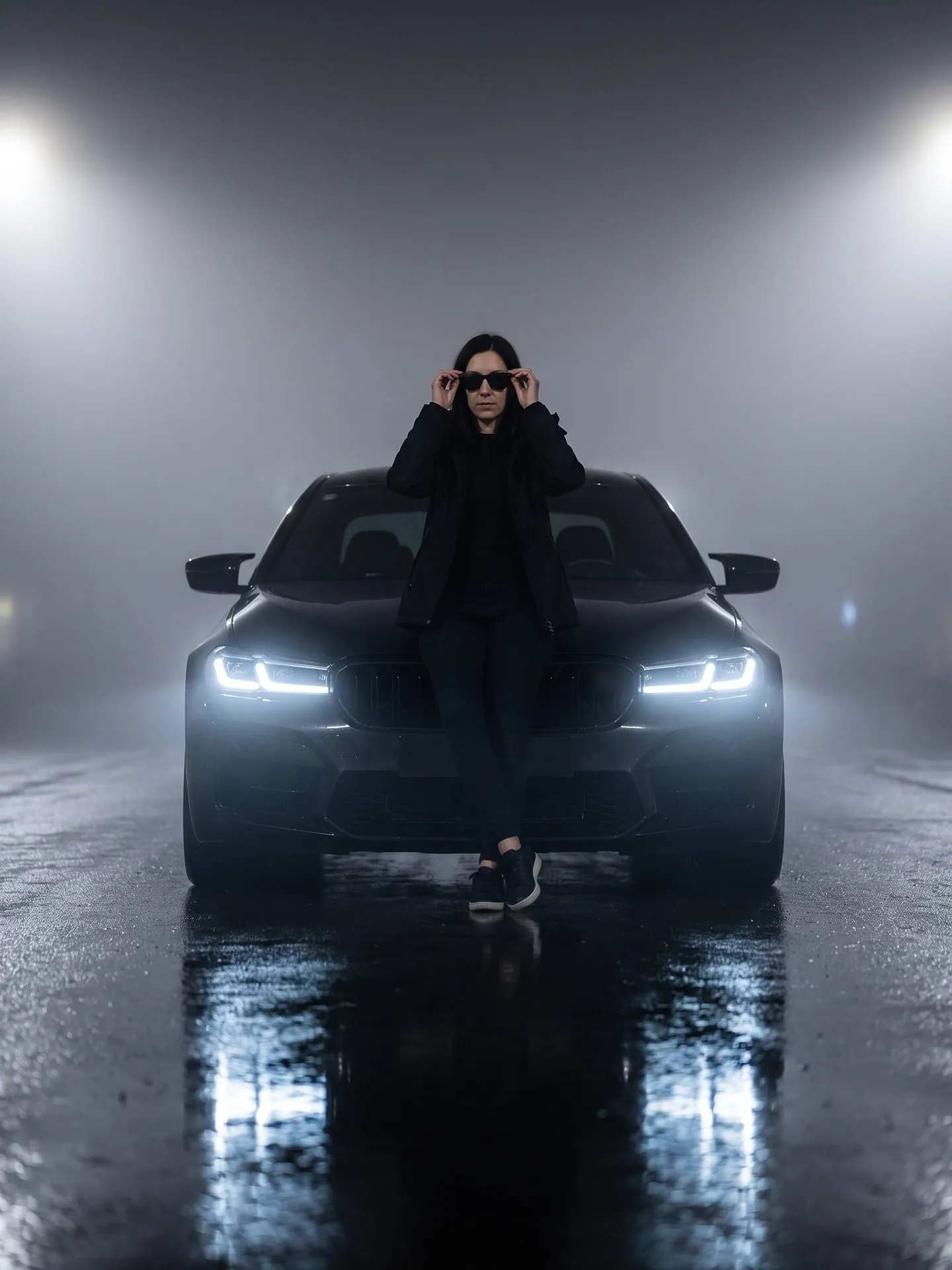 Woman in a black jacket adjusting sunglasses by a black BMW M5 F90 in night fog, made from the copy-paste prompt